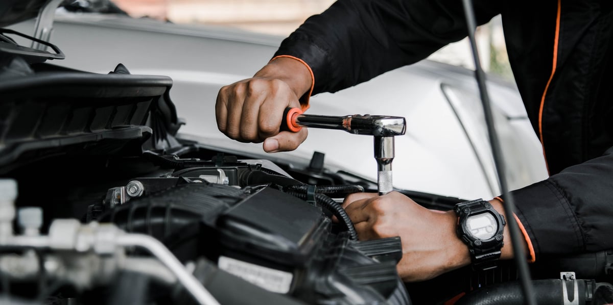 1st Wheels Garage mechanic repairing a car