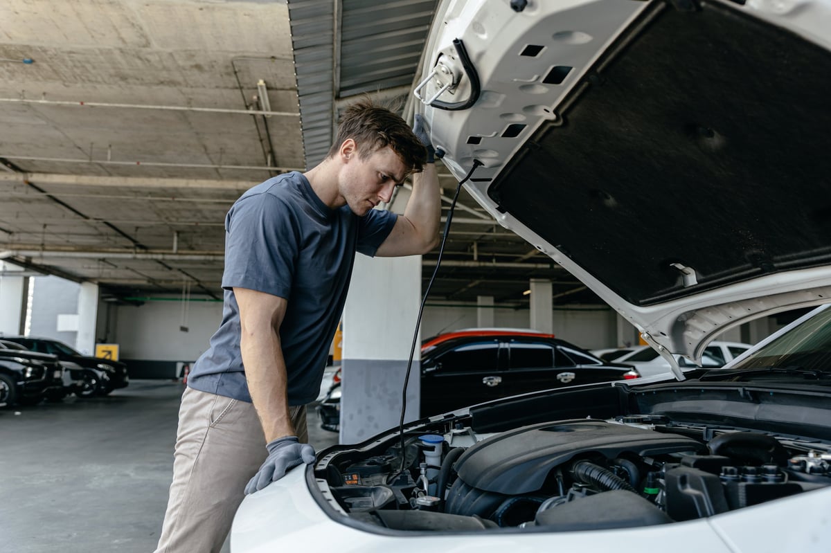 Mechanic inspecting a car engine at the workshop at 1st Wheels Garage